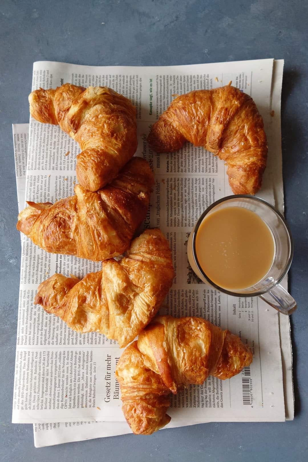 Croissants on a wooden chopping board